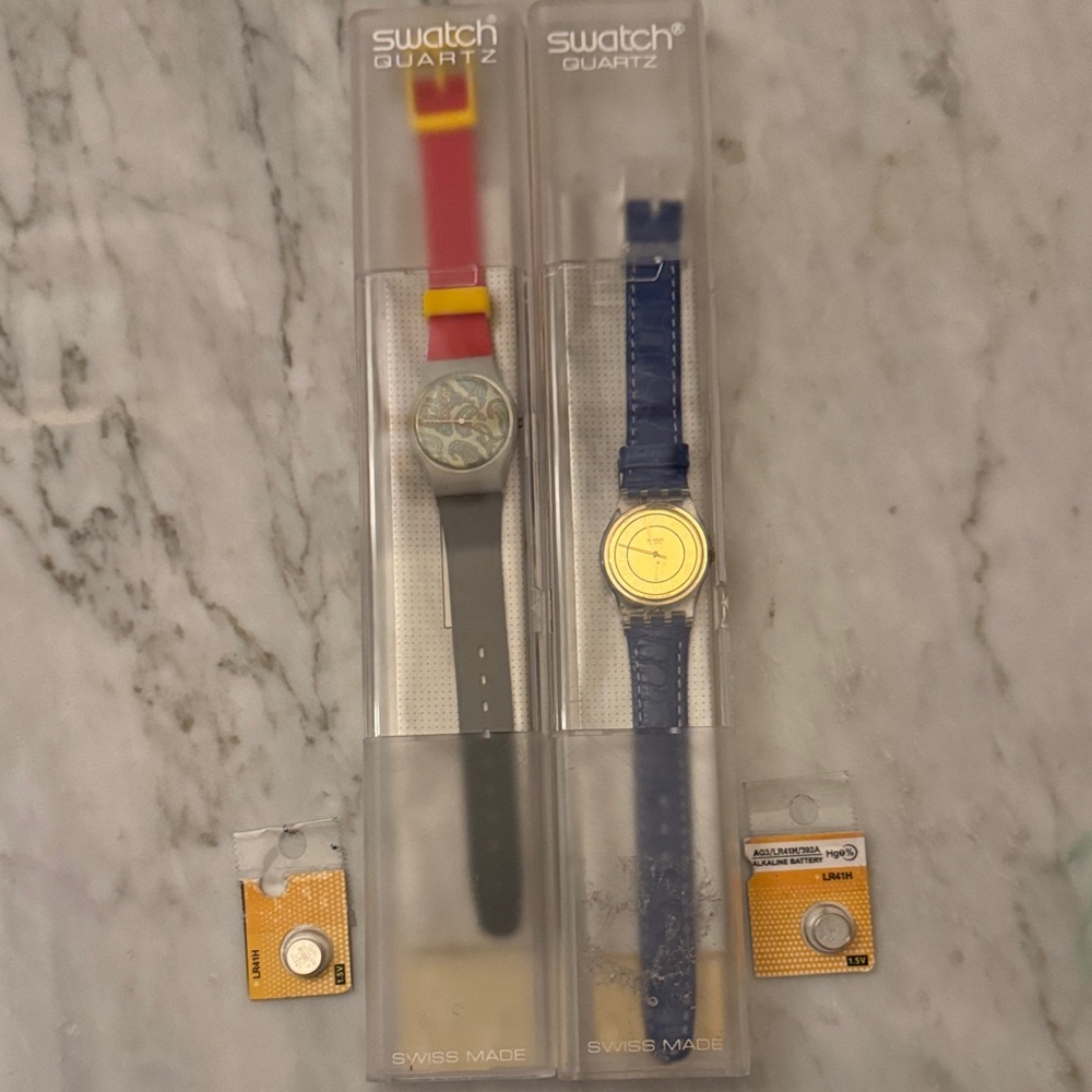 (2) Swatch Blue Strap with Gold Dial & Red-Gray Multi-Color Strap Duo,Batteries